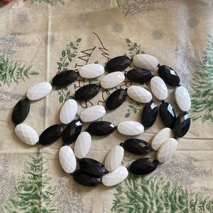 Black & white faceted plastic beads no clasp knotted between beads aprox 35”